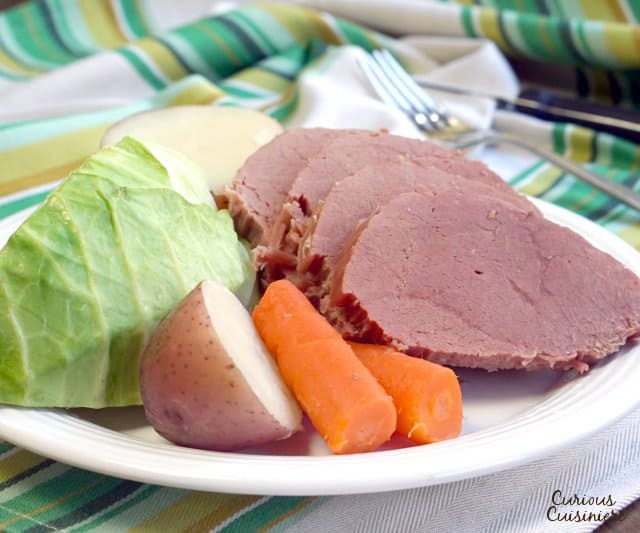 While it might not be an Irish dish, Corned Beef and Cabbage has become the staple dish of St. Patrick's Day. Find out why! | www.CuriousCuisiniere.com