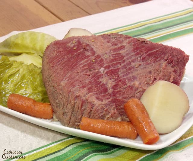 While it might not be an Irish dish, Corned Beef and Cabbage has become the staple dish of St. Patrick's Day. Find out why! | www.CuriousCuisiniere.com