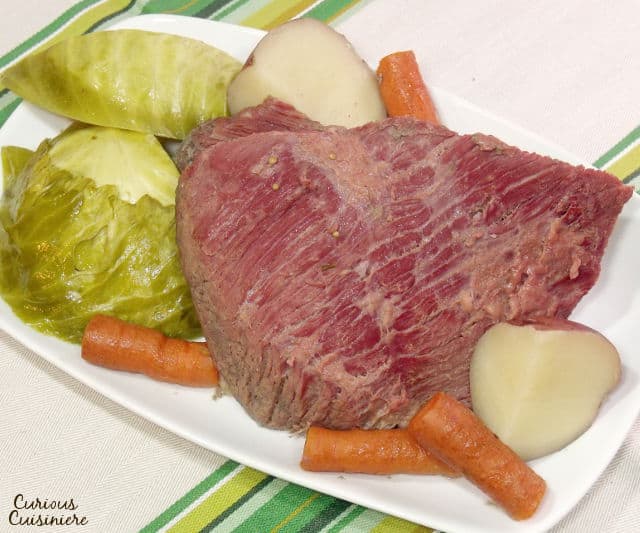 While it might not be an Irish dish, Corned Beef and Cabbage has become the staple dish of St. Patrick's Day. Find out why! | www.CuriousCuisiniere.com