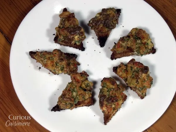 Our Baked Shrimp Toast, crispy toast, topped with a warm garlic and herb shrimp spread,  are a lighter version of the classic dim sum appetizer bites. | Curious Cuisiniere