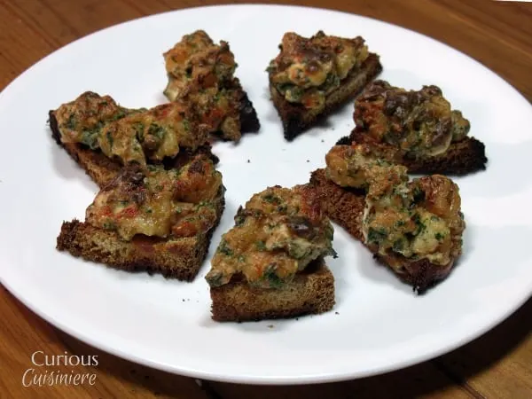 Our Baked Shrimp Toast, crispy toast, topped with a warm garlic and herb shrimp spread,  are a lighter version of the classic dim sum appetizer bites. |  Curious Cuisiniere