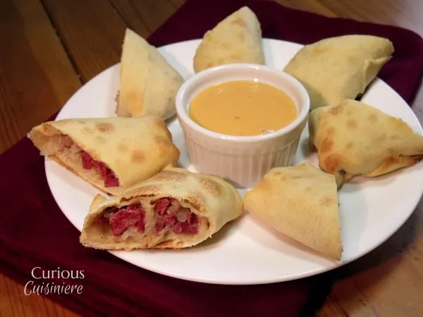 A baked-crisp exterior keeps these flavorful Corned Beef and Cabbage Irish Egg Rolls light, yet crispy! | www.CuriousCuisiniere.com