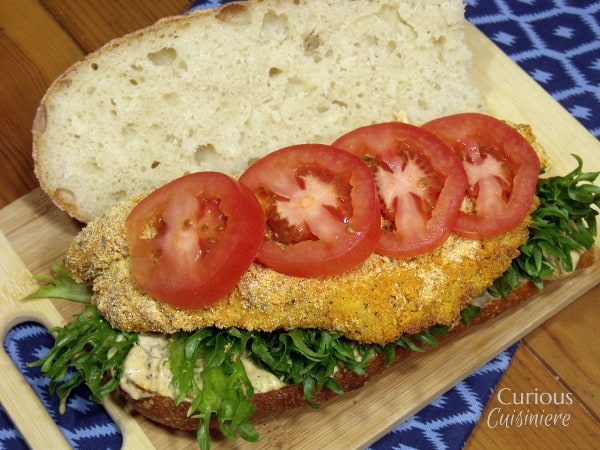 The classic New Orleans Catfish Po'Boy sandwich gets a lighter spin by baking the fish. And, a Louisiana Remoulade Sauce is sure to get this party started! | www.CuriousCuisiniere.com