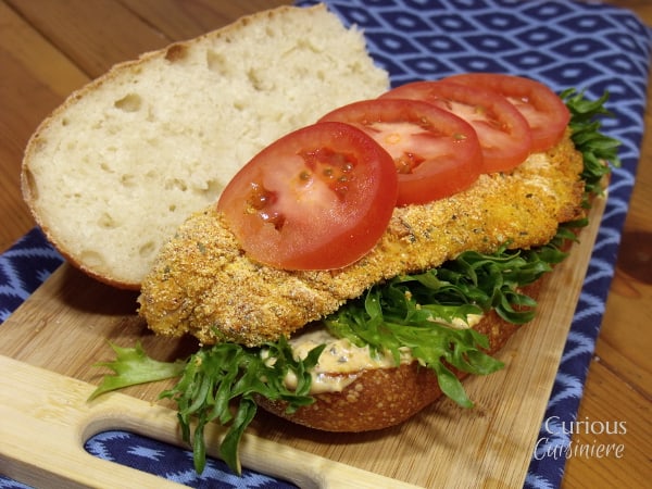 The classic New Orleans Catfish Po'Boy sandwich gets a lighter spin by baking the fish. And, a Louisiana Remoulade Sauce is sure to get this party started! | www.CuriousCuisiniere.com