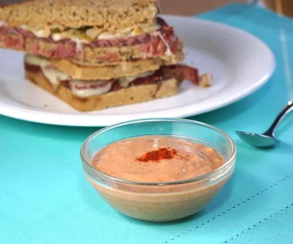 Our homemade Russian Dressing is tangy, slightly spicy, and seriously addicting! It's the perfect sauce for a Reuben Sandwich and more!| CuriousCuisiniere