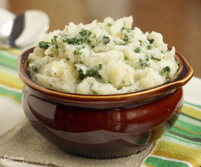 Irish Colcannon brings mashed potatoes to a whole new level with flavorful onions and nutritious cabbage. These Irish mashed potatoes are the perfect way to sneak extra veggies into your meal! | www.CuriousCuisiniere.com