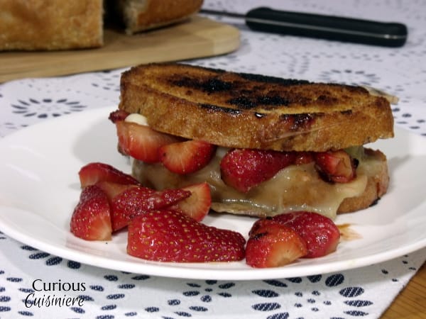 Balsamic Marinated Strawberries give this spring inspired Grilled Cheese a crazy and unique burst of flavor. Trust us, this is a combo you need to try! | Curious Cuisiniere