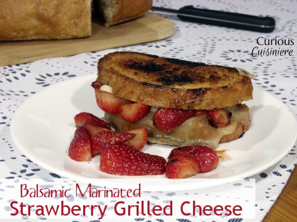 Balsamic Marinated Strawberries give this spring inspired Grilled Cheese a crazy and unique burst of flavor. Trust us, this is a combo you need to try! | Curious Cuisiniere
