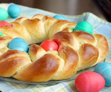 Italian Easter Bread, Pane di Pasqua, studded with brightly dyed easter eggs. | www.CuriousCuisiniere.com
