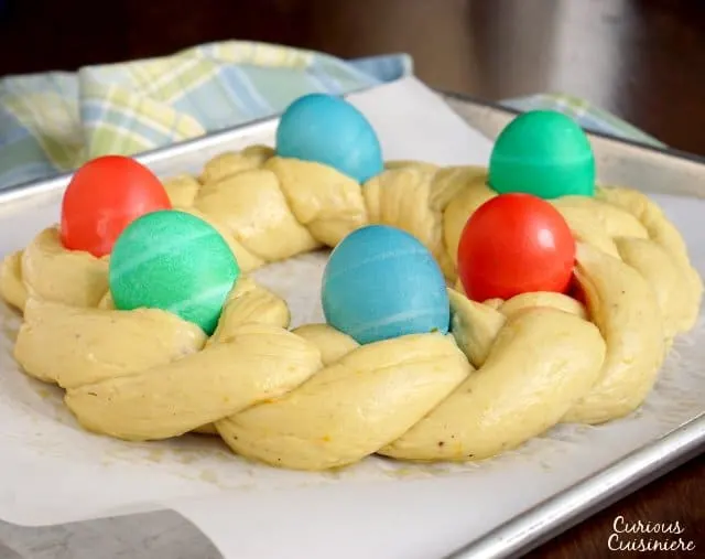 Italian Easter Bread, Pane di Pasqua, shaped in a braided ring and ready to go into the oven. | www.CuriousCuisiniere.com