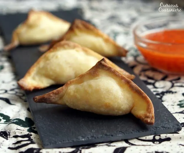 The perfect, crispy and creamy appetizer recipe, these Baked Crab Rangoon are a healthier way to satisfy your craving for Chinese takeout. | www.CuriousCuisiniere.com