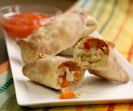 Baked Vegetable Egg Rolls are a healthier alternative to that family-favorite take-out treat. Great to freeze for later so you always have some on hand! | www.CuriousCuisiniere.com