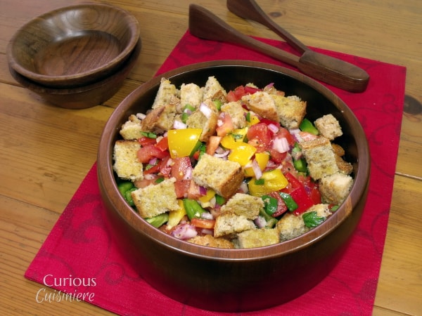 This take on Tuscan Bread Salad, or Panzanella, adds sweet peppers and red onions to the traditional dish of toasted bread and tomatoes. | Curious Cuisiniere #PicnicGame #SundaySupper