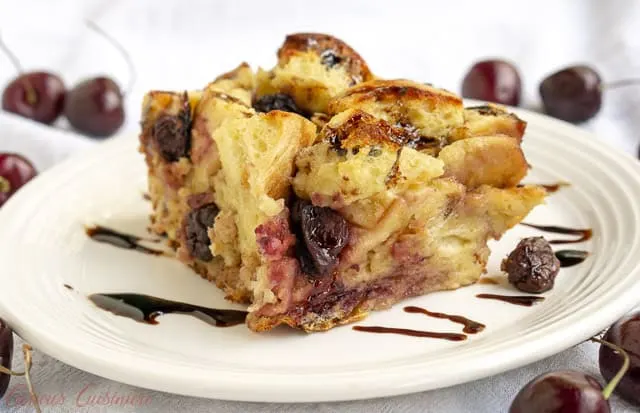 A balsamic glaze gives this cherry bread pudding an unexpected burst of bright flavor. This recipe is the perfect way to use stale bread and makes a wonderful breakfast or dessert! | www.CuriousCuisiniere.com