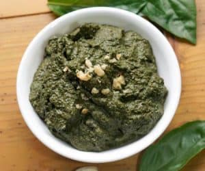 You don't have to wait until summer's harvest to enjoy fresh basil pesto! This basic pesto recipe is perfect for freezing so you can enjoy it all year long. | www.CuriousCuisiniere.com