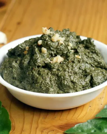 You don't have to wait until summer's harvest to enjoy fresh basil pesto! This basic pesto recipe is perfect for freezing so you can enjoy it all year long. | www.CuriousCuisiniere.com
