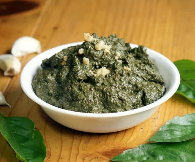 You don't have to wait until summer's harvest to enjoy fresh basil pesto! This basic pesto recipe is perfect for freezing so you can enjoy it all year long. | www.CuriousCuisiniere.com