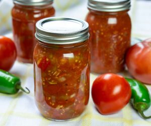 Tomato salsa for canning in jars with produce