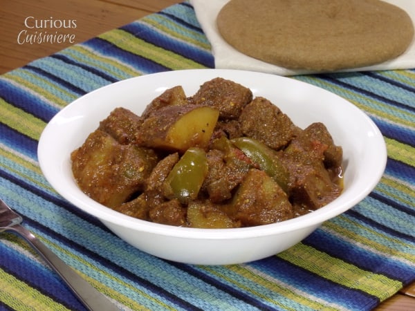 This Madras Curry is a warming dish that is perfect for a cool evening. This slow cooker beef curry brings deep flavors and tender meat with little effort. - Curious Cuisiniere 