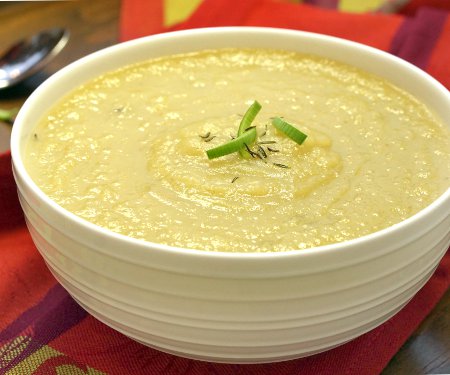 A slightly sweet and immensely comforting recipe for a fall soup, this Roasted Parsnip Apple Soup is sure to warm those cool fall days. | www.CuriousCuisiniere.com