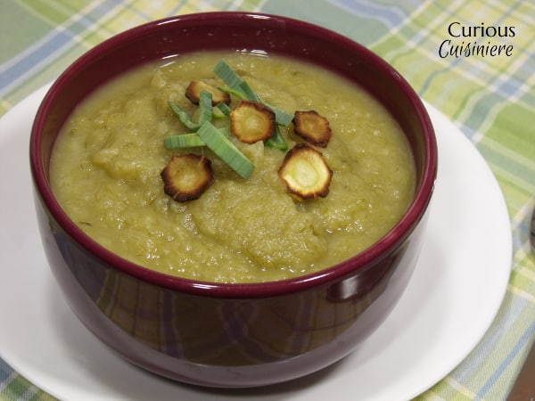 A slightly sweet and immensely comforting recipe for a fall soup, this Roasted Parsnip Apple Soup is sure to warm those cool fall days. | www.CuriousCuisiniere.com