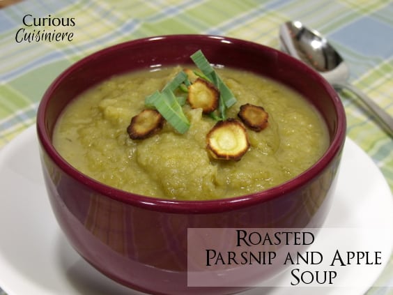 A slightly sweet and immensely comforting recipe for a fall soup, this Roasted Parsnip Apple Soup is sure to warm those cool fall days. | www.CuriousCuisiniere.com