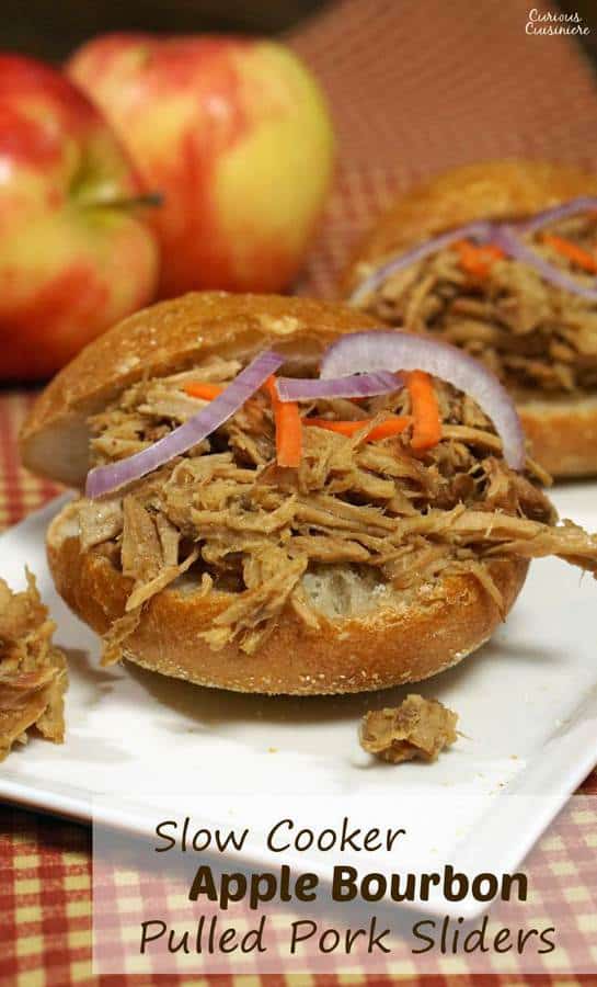 Apple adds sweetness to this slow cooker bourbon pulled pork. This dish makes for great appetizer sliders or an easy main meal! Double (or triple) the recipe to serve a crowd! | www.CuriousCuisiniere.com 
