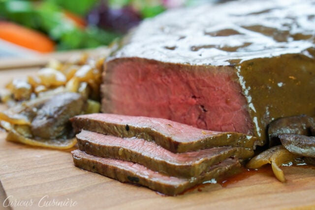 Caramelized onion and mushroom slow cooker Sirloin Tip Roast sliced for sandwiches