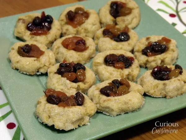These Thumbprint Mincemeat Cookies use homemade fruit mincemeat to bring a fun new twist to your holiday cookie platter. - from Curious Cuisiniere