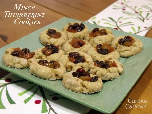These Thumbprint Mincemeat Cookies use homemade fruit mincemeat to bring a fun new twist to your holiday cookie platter. - from Curious Cuisiniere