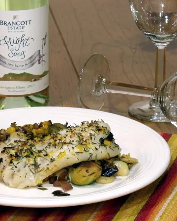 With all the flavor of lemon and thyme, this easy to prepare grouper recipe tastes indulgent, while fitting into your healthy resolutions. | www.CuriousCuisiniere.com