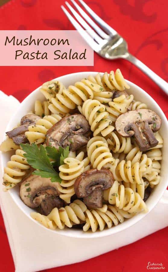 Herbs with a light vinegar dressing give this Mushroom Pasta Salad a bright but earthy flavor. Serve it hot or cold to suit the season. | Curious Cuisiniere