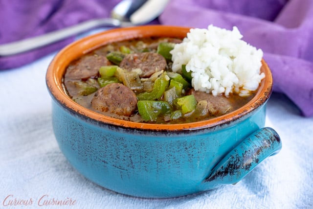 A bowl of Cajun gumbo with Andouille sausage and rice. | www.CuriousCuisiniere.com