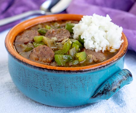 A bowl of Cajun gumbo with Andouille sausage and rice. | www.CuriousCuisiniere.com