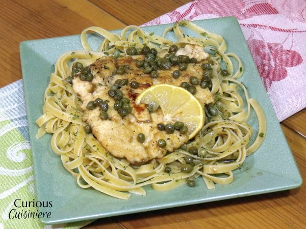 Lemon Chicken Piccata is an easy and flavorful dish that is the perfect recipe for a quick weeknight dinner. | www.CuriousCuisiniere.com