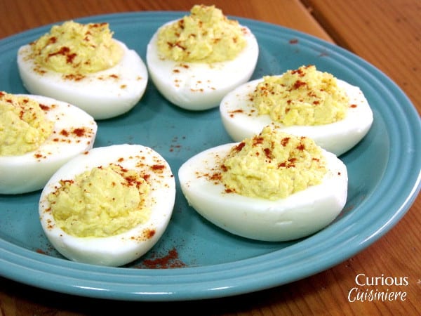 Creamy, mustard-y deviled eggs just make us think of Easter and spring. | www.CuriousCuisiniere.com