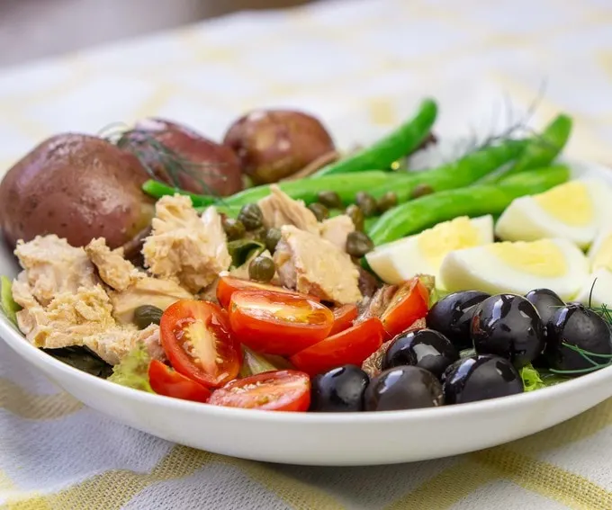 French Salade Nicoise (Nicoise Salad) with boiled potatoes and anchovies