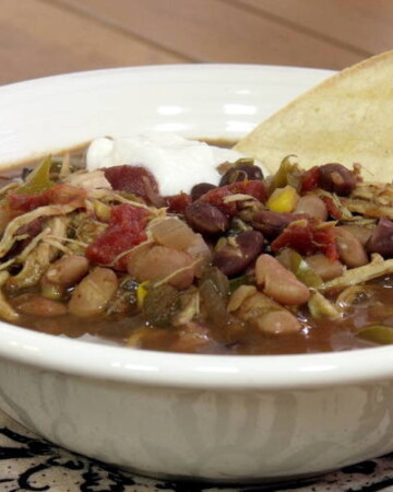 The use of a slow cooker makes this American-style Chicken Tortilla Soup a perfect weeknight meal. Throw it together before work, and come home to dinner (and an amazing-smelling home). | www.curiouscuisiniere.com