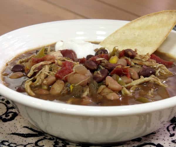 The use of a slow cooker makes this American-style Chicken Tortilla Soup a perfect weeknight meal. Throw it together before work, and come home to dinner (and an amazing-smelling home). | www.curiouscuisiniere.com