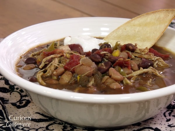 The use of a slow cooker makes this American-style Chicken Tortilla Soup a perfect weeknight meal. Throw it together before work, and come home to dinner (and an amazing-smelling home). | www.curiouscuisiniere.com 