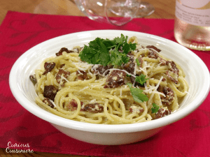 There's nothing not to love about bacon, cheese, and pasta that make up this classic and easy Spaghetti alla Carbonara recipe. | Curious Cuisiniere