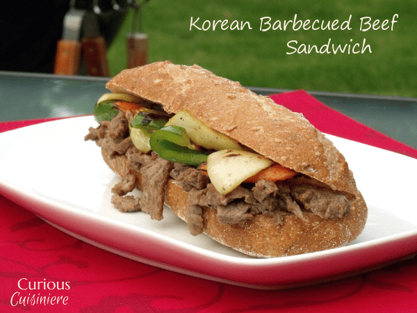 Tender beef steak marinated in a sweet Korean sauce makes this Bulgogi Sandwich anything but ordinary. | www.CuriousCuisiniere.com