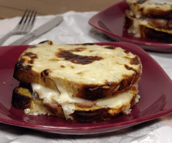 The French version of a grilled cheese brings ham, Dijon mustard, Swiss cheese, and a creamy sauce together in one epic sandwich. 