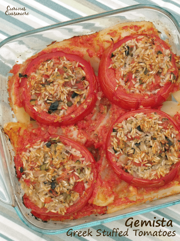 Greek Gemista brings big juicy tomatoes together with a healthy, vegetarian mixture of rice and summer produce, creating a perfect summer dish. | Curious Cuisiniere