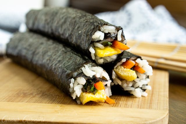 Kimbap (or gimbap) could be called Korean sushi, and if you are a fan of sushi, you are going to love the light and slightly nutty flavor of these rolls. They're the perfect recipe for summer picnics and lunches!  | www.CuriousCuisiniere.com