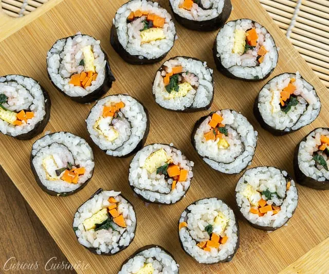 Kimbap (or gimbap) could be called Korean sushi, and if you are a fan of sushi, you are going to love the light and slightly nutty flavor of these rolls. They're the perfect recipe for summer picnics and lunches!  | www.CuriousCuisiniere.com