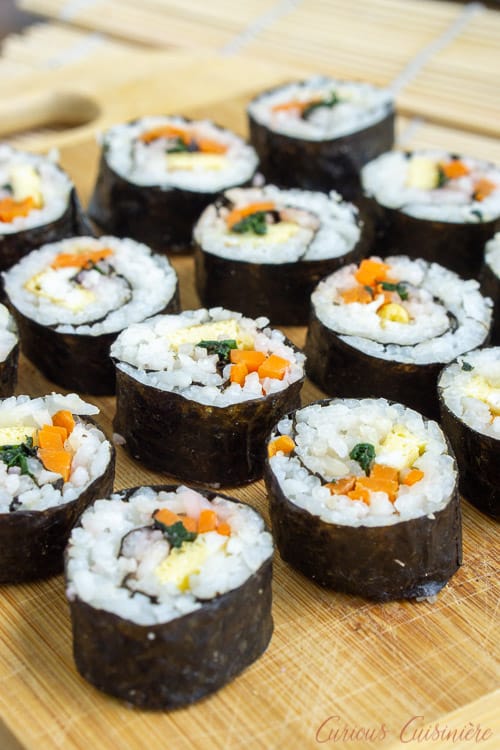 Kimbap (or gimbap) could be called Korean sushi, and if you are a fan of sushi, you are going to love the light and slightly nutty flavor of these rolls. They're the perfect recipe for summer picnics and lunches!  | www.CuriousCuisiniere.com