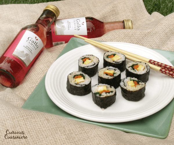 Similar in style to Japanese sushi, Korean Kimbap has a mildly nutty flavor and are packed with veggies, eggs, even cooked meats. They are perfect to pack along for a summer picnic! #SundaySupper