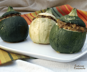 Cute round zucchini are stuffed with a mixture of herbs and sausage. How can you go wrong with zucchini this cute?