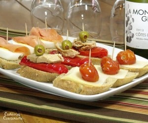 Fun, flavorful ingredients, piled high on a thick baguette slice make for unique appetizers or party food. | www.curiouscuisiniere.com